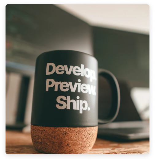 Minimalistic mug with 'Develop. Preview. Ship.' written on it